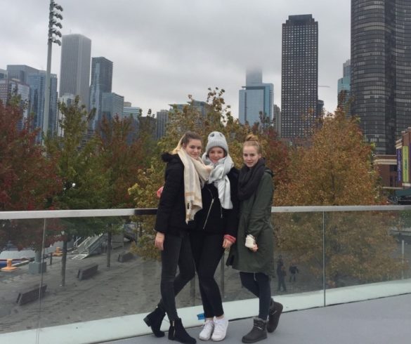 Vanessa and two au pair friends posing in front of the Chicago skyline.